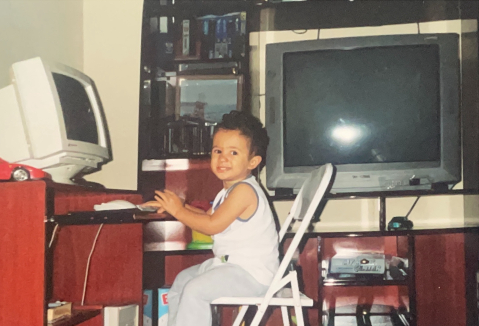me as a baby sitting in front of a computer